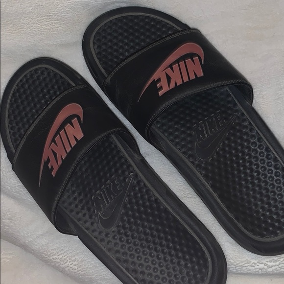 gold and black nike slides